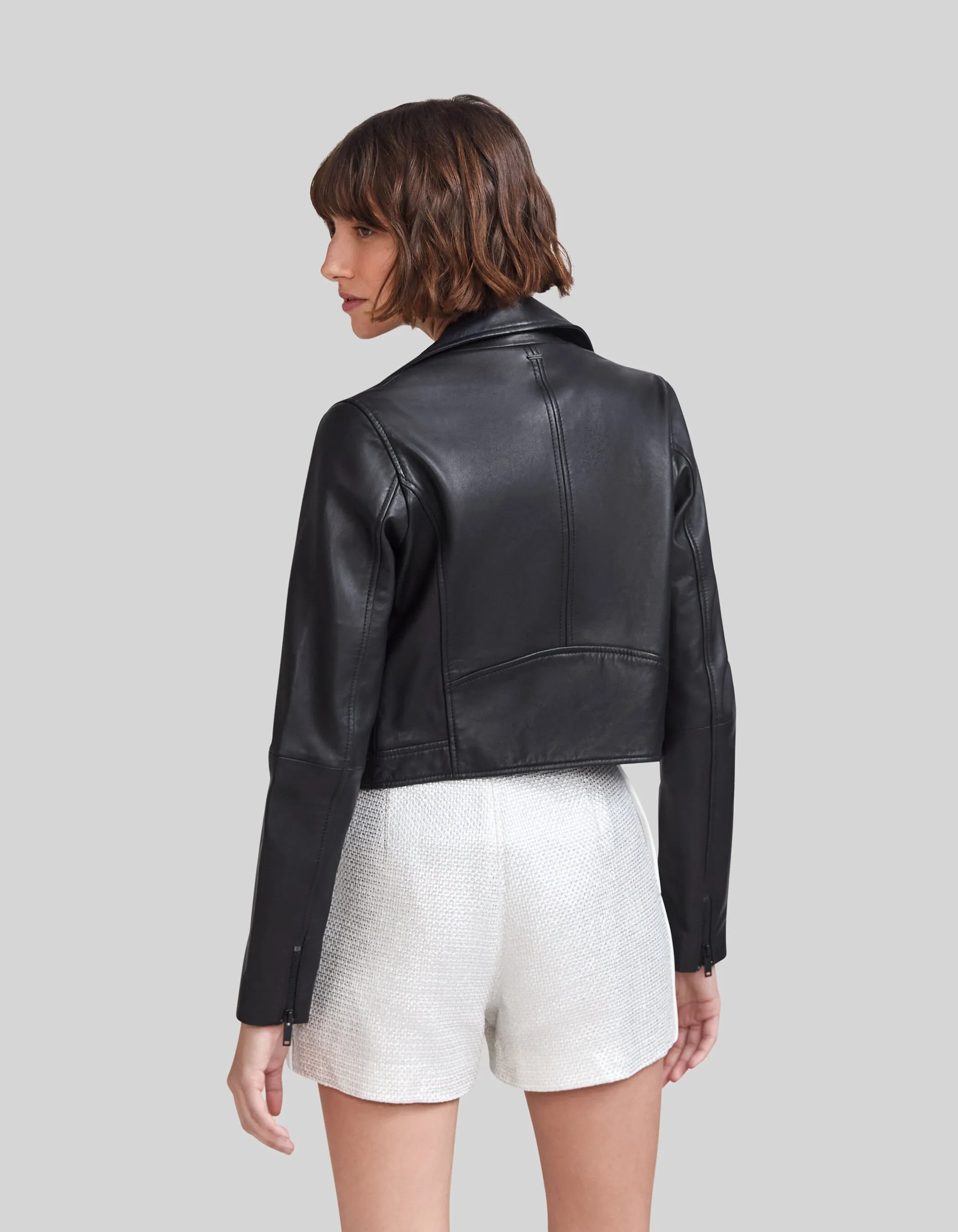 Veste noire en cuir esprit motard décor chaînettes Femme